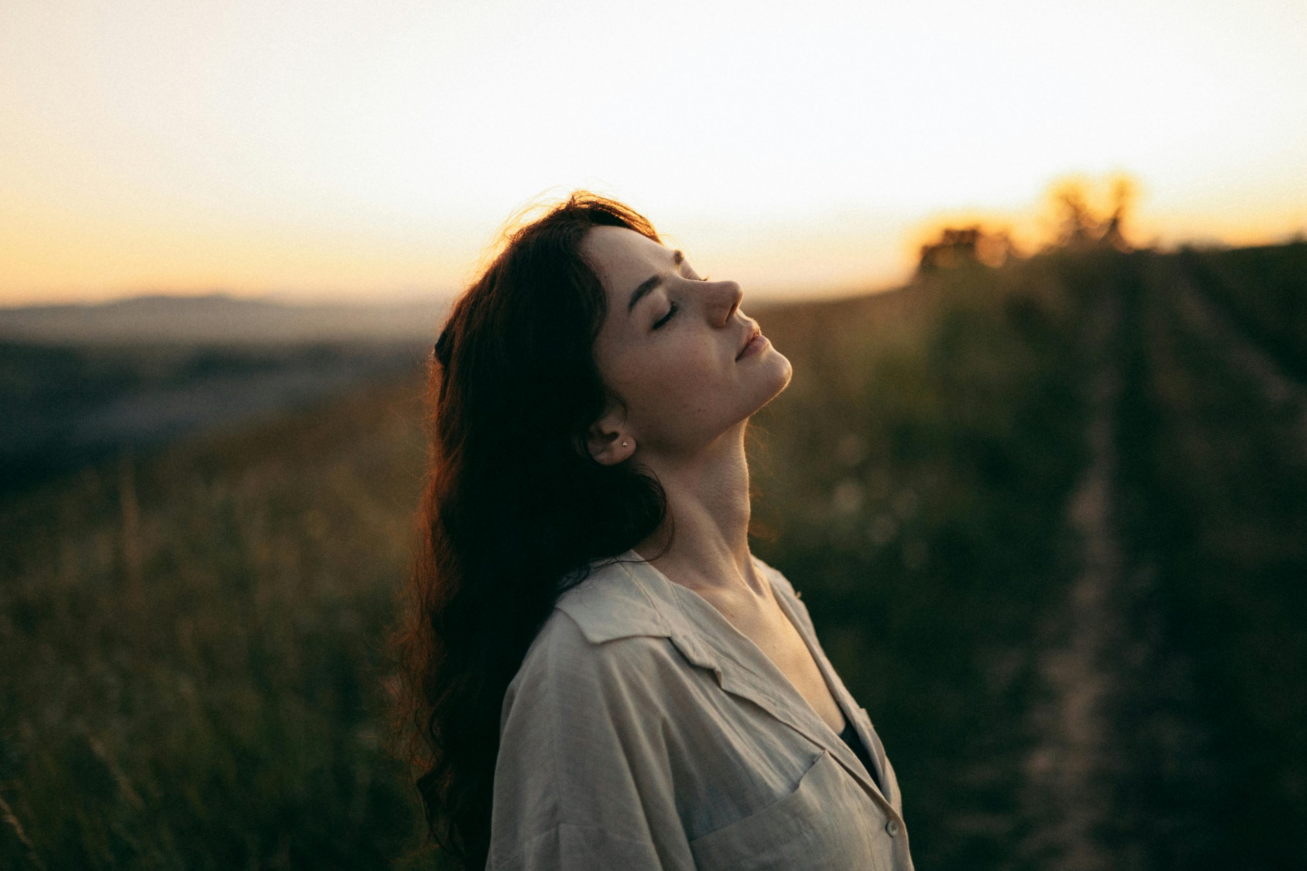 a woman standing in a field